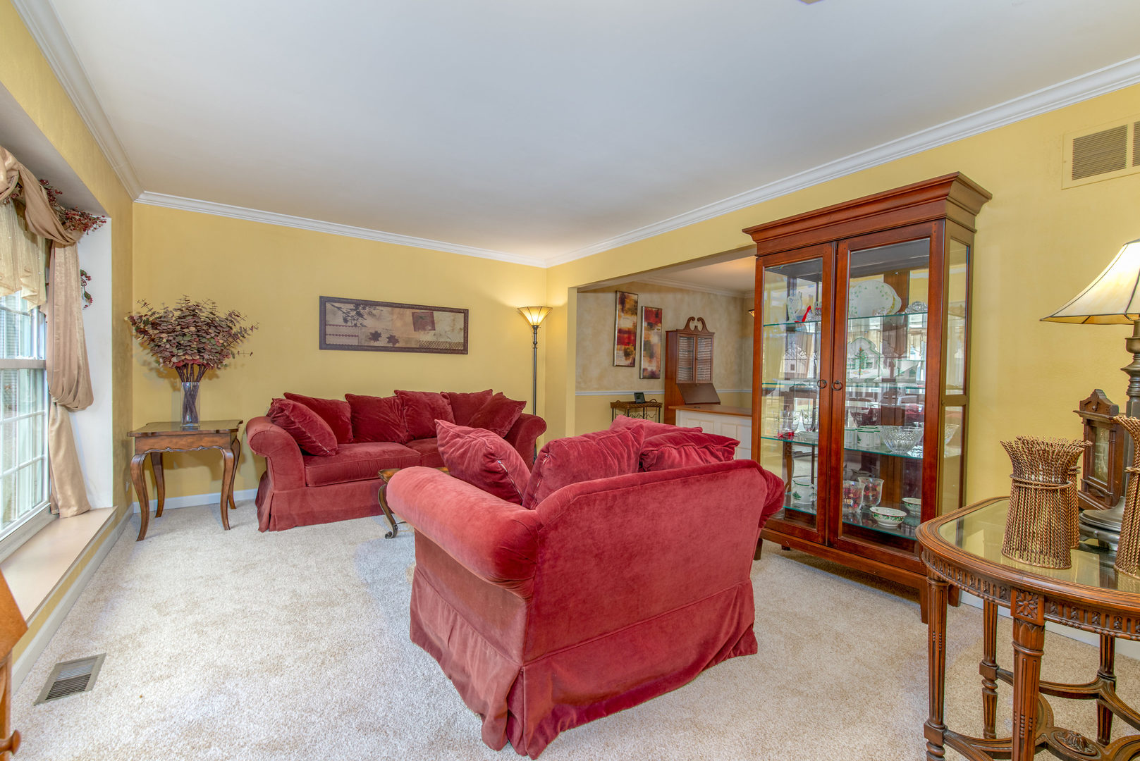2105 Countryside Circle Naperville, IL 60565 - Photo 4 of 26 a living room with furniture and a floor to ceiling window