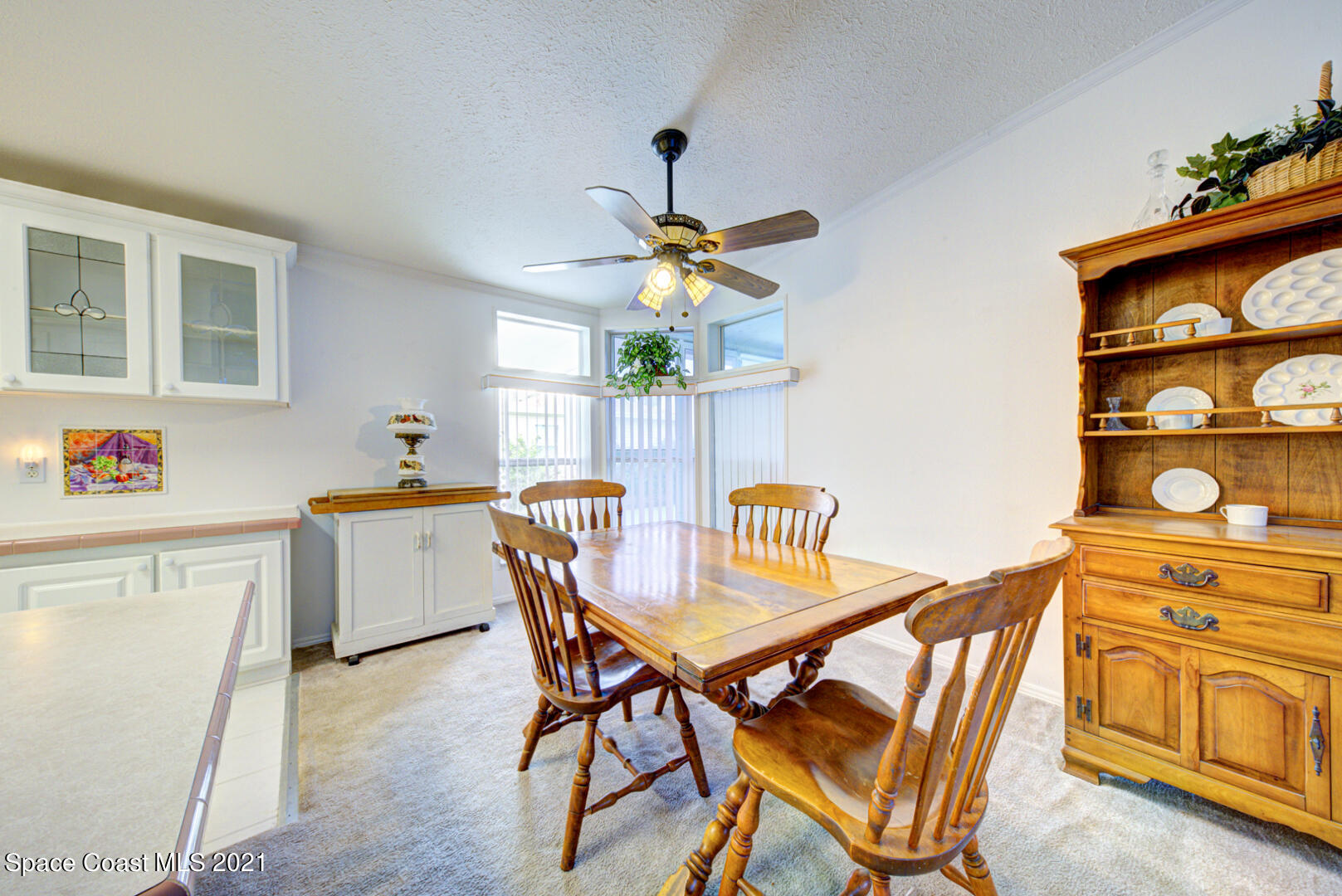 253 Timber Run Way, Unit 309 Cocoa, FL 32926 - Photo 11 of 38 dining room with fan