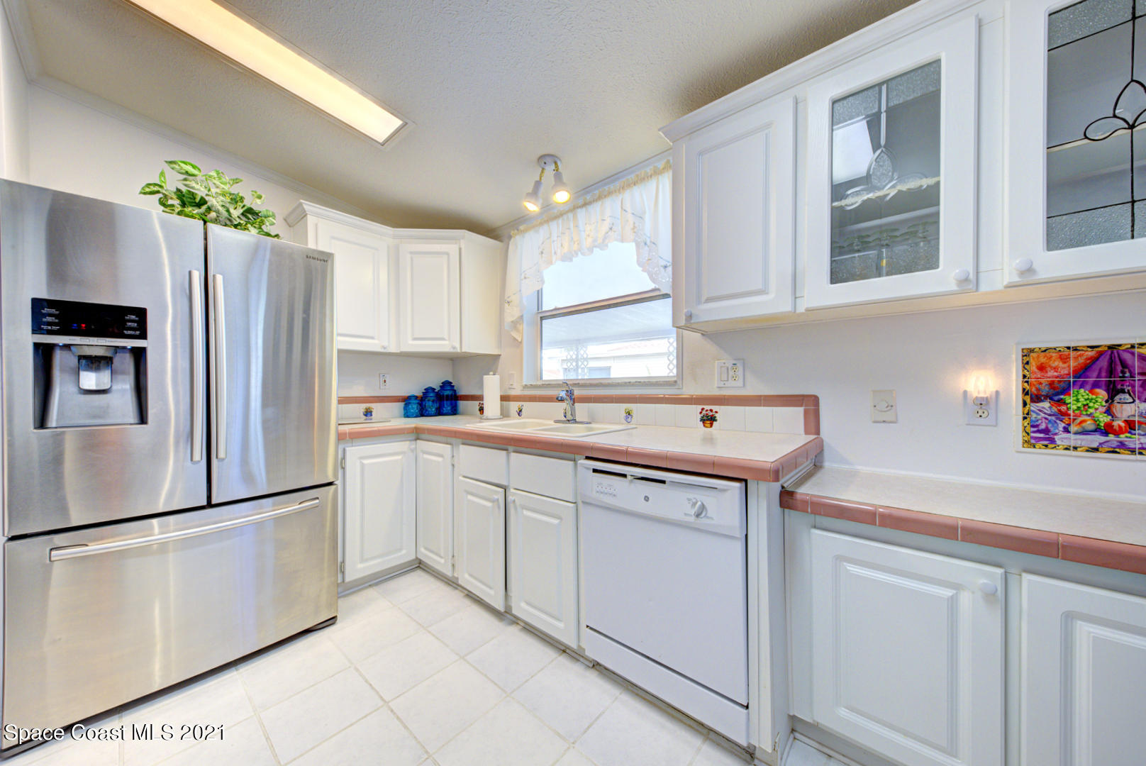 kitchen with glass front cabinets