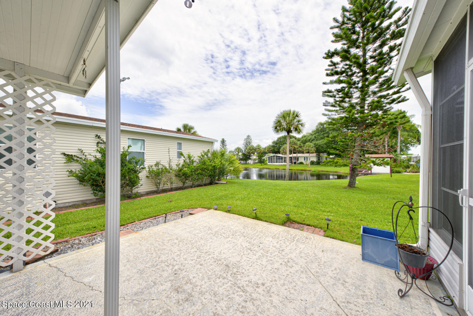 253 Timber Run Way, Unit 309 Cocoa, FL 32926 - Photo 31 of 38 patio with lake view