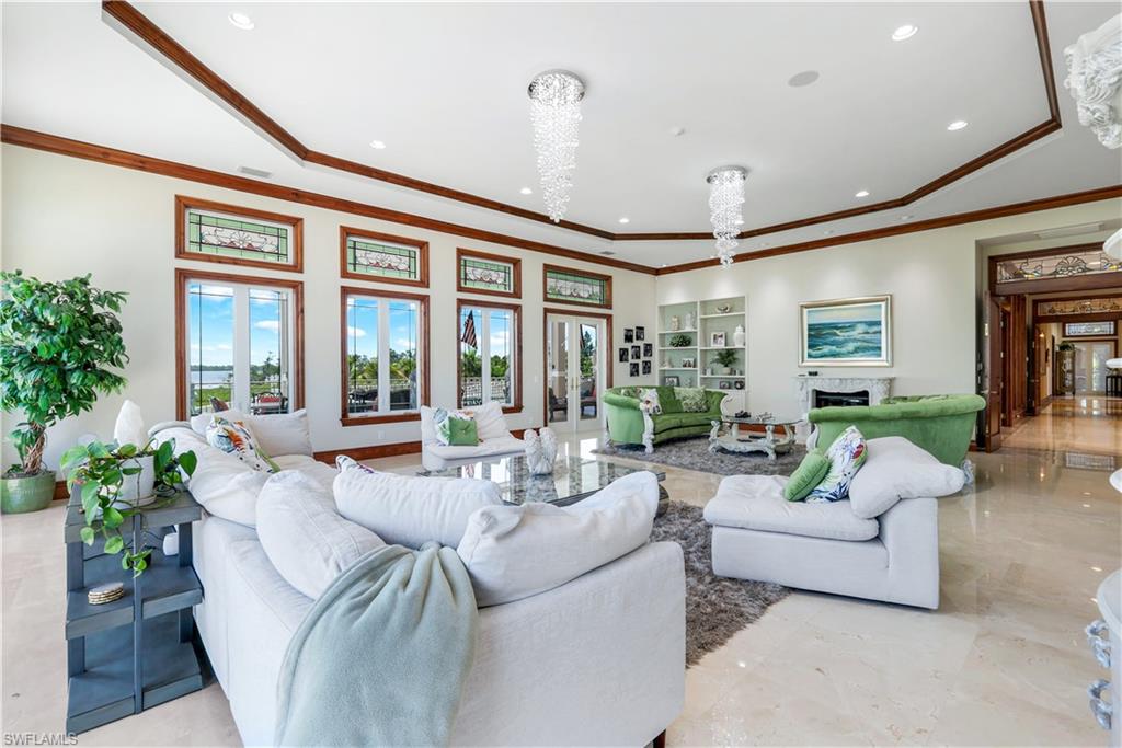 7159 Manasota Key Road Englewood, FL 34223 - Photo 13 of 50 a living room with furniture and a large window
