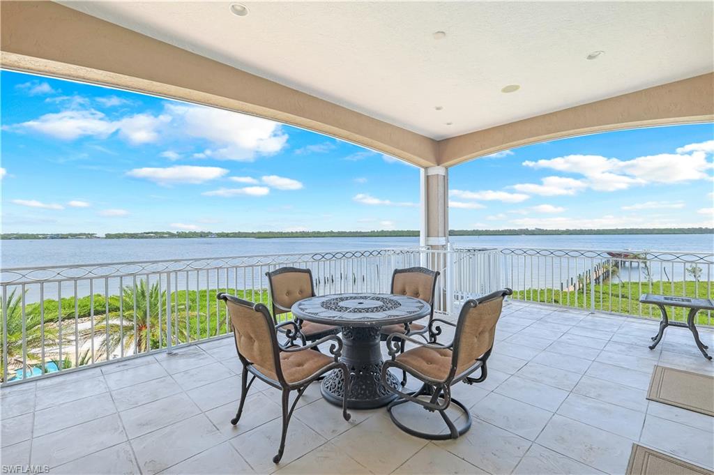 7159 Manasota Key Road Englewood, FL 34223 - Photo 22 of 50 View of primary suite patio with a water view