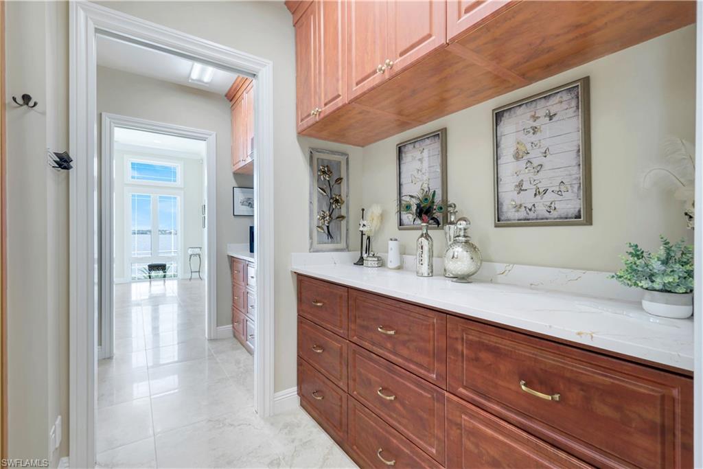 7159 Manasota Key Road Englewood, FL 34223 - Photo 26 of 50 a spacious bathroom with a sink a mirror and a shower