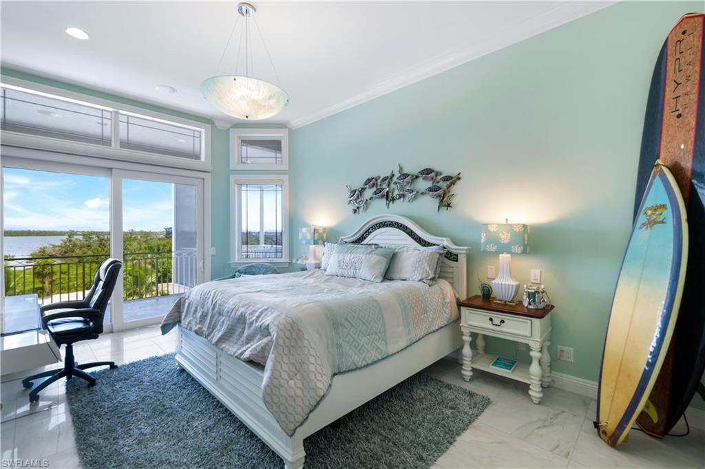 7159 Manasota Key Road Englewood, FL 34223 - Photo 30 of 50 Bedroom with access to exterior, crown molding, recessed lighting, and a water view