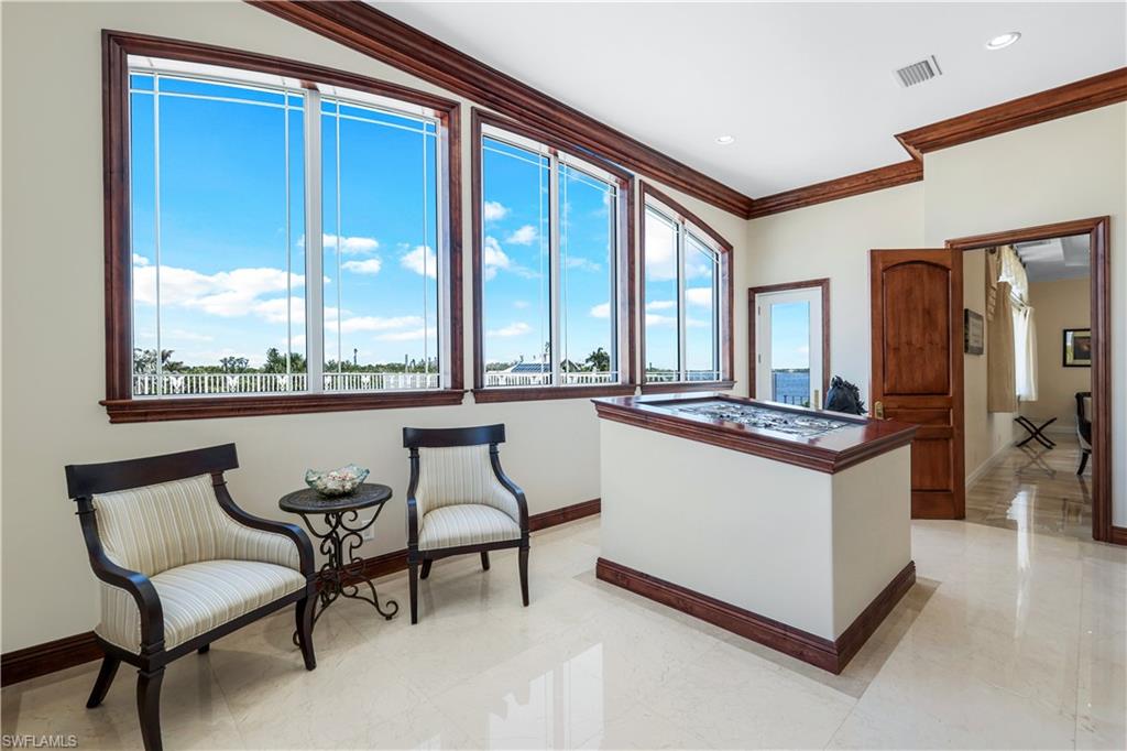 7159 Manasota Key Road Englewood, FL 34223 - Photo 34 of 50 a kitchen with stainless steel appliances granite countertop a stove and a refrigerator
