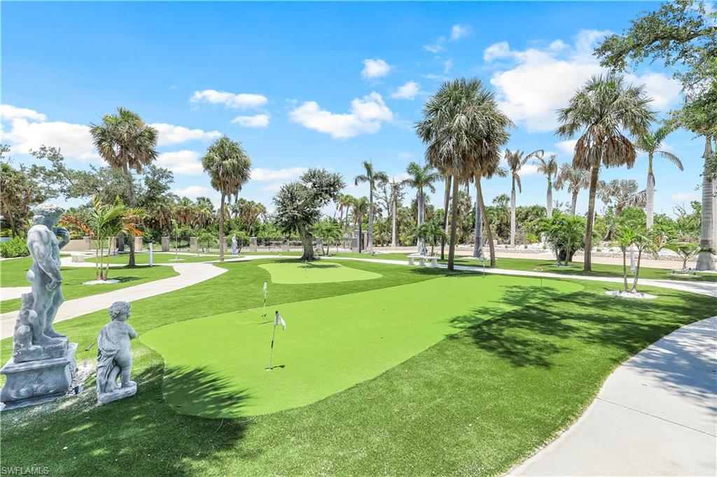 7159 Manasota Key Road Englewood, FL 34223 - Photo 39 of 50 Surrounding front yard featuring a putting area and a yard