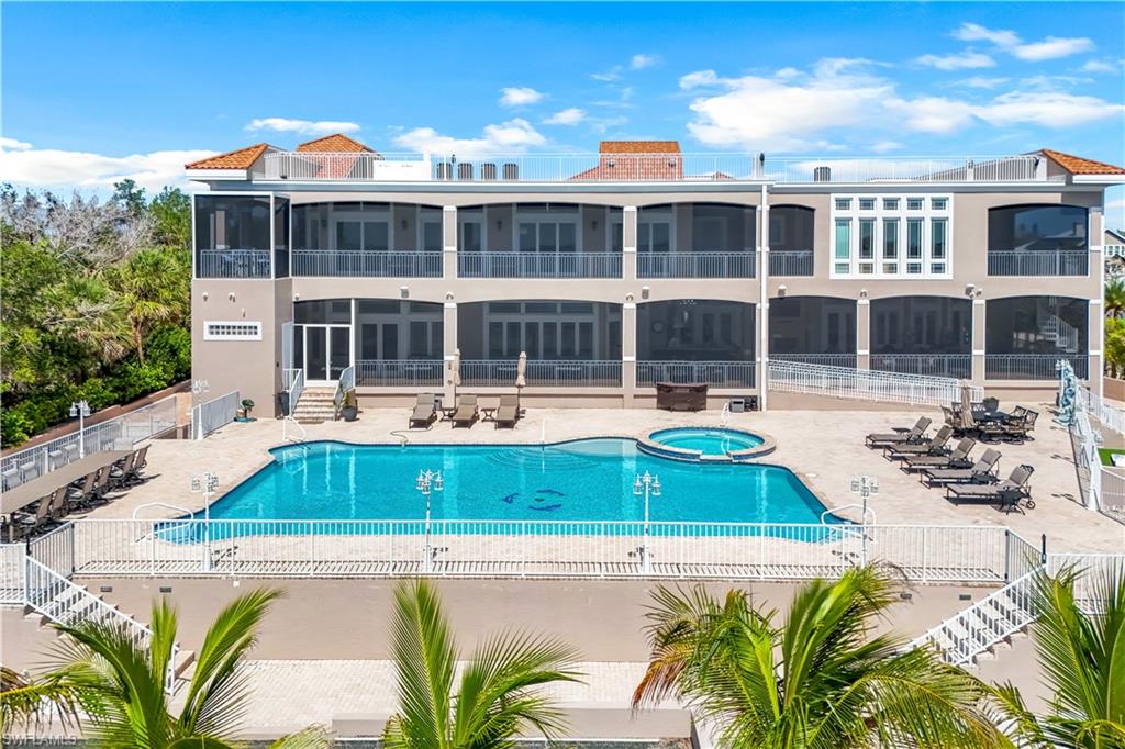 7159 Manasota Key Road Englewood, FL 34223 - Photo 46 of 50 a front view of a house with a swimming pool