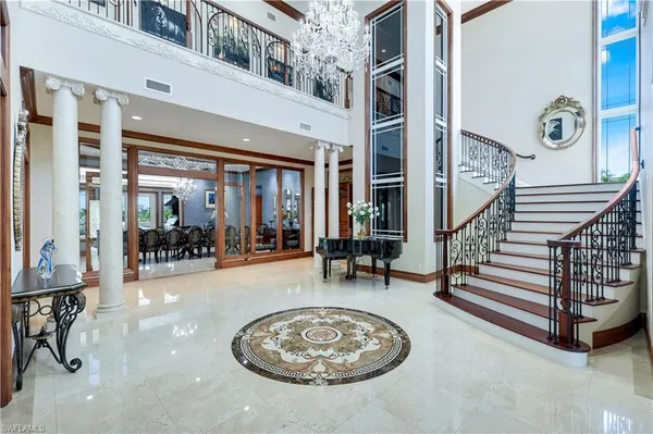 a view of a livingroom with furniture and floor to ceiling window