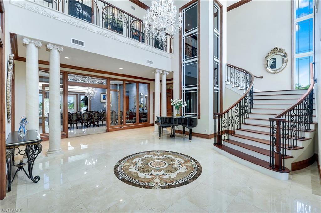7159 Manasota Key Road Englewood, FL 34223 - Photo 8 of 50 a view of a livingroom with furniture and floor to ceiling window