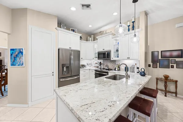 $675,000 | 3663 Woods Walk Boulevard, Wellington, FL 33467