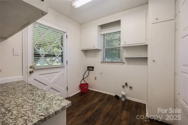 a workspace with a bookshelf and a chair