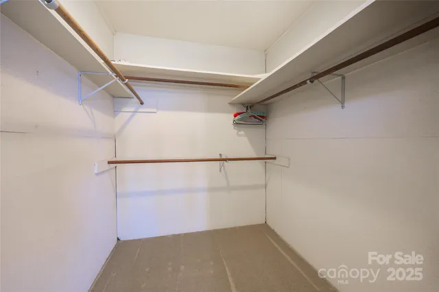 a bathroom with a granite countertop sink a mirror and a shower