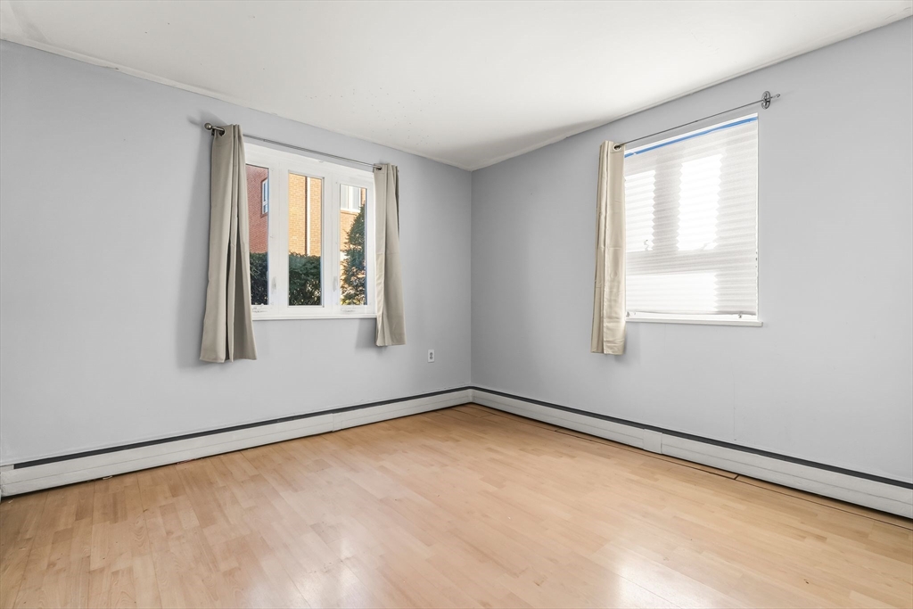 133 Warren Street, Unit 3 Watertown, MA 02472 - Photo 16 of 22 a view of an empty room with a window