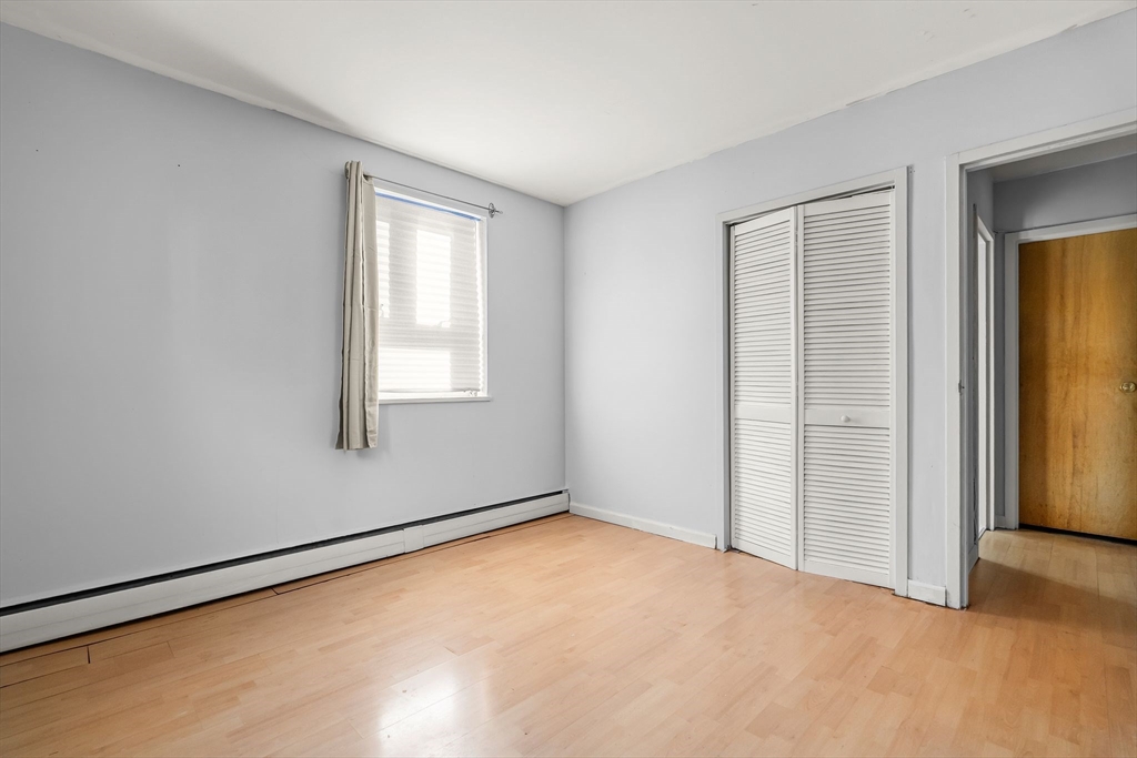 133 Warren Street, Unit 3 Watertown, MA 02472 - Photo 17 of 22 an empty room with windows
