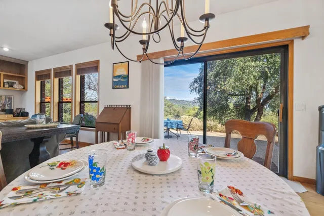 a bedroom with furniture and a large window