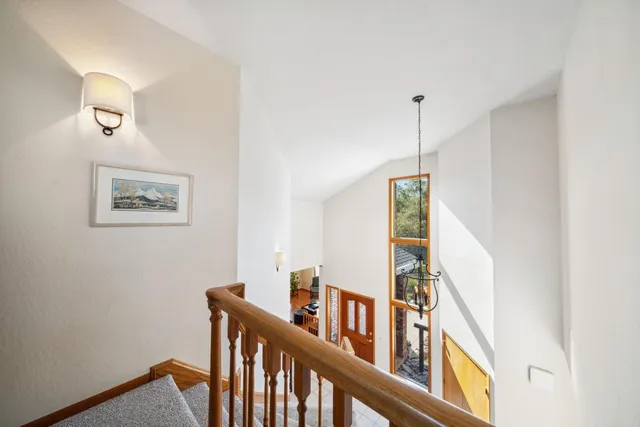 a view of a hallway with windows