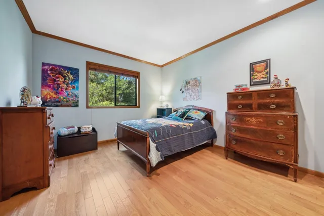 a bedroom with a bed and furniture