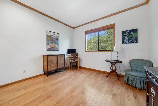 a workspace with furniture and a window