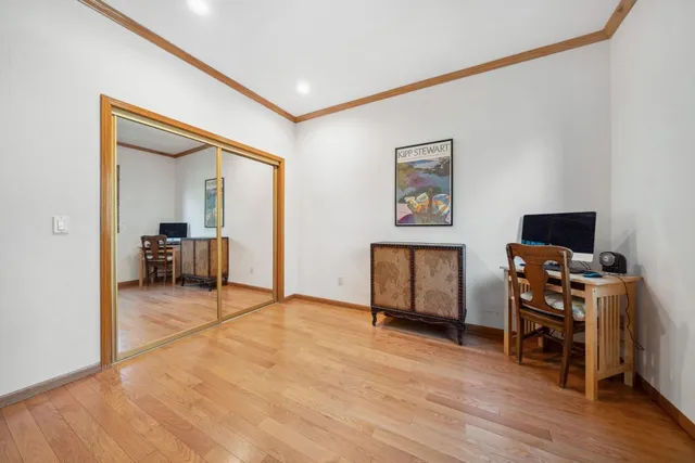 a view of a livingroom with furniture and a flat screen tv