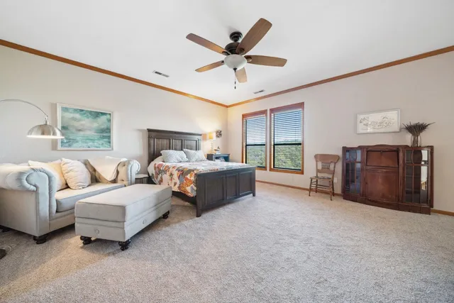 a living room with furniture and ceiling fan