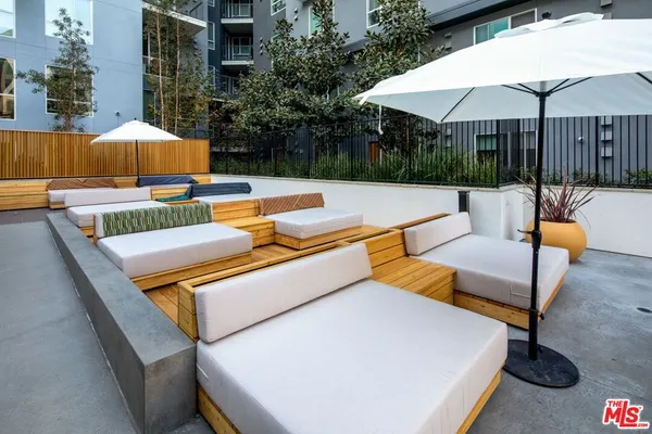 a view of a patio with chairs and a table