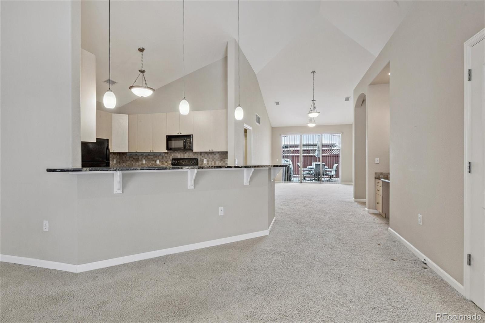 8650 Gold Peak Drive, Unit A Highlands Ranch, CO 80130 - Photo 12 of 47 a view of a kitchen and a window