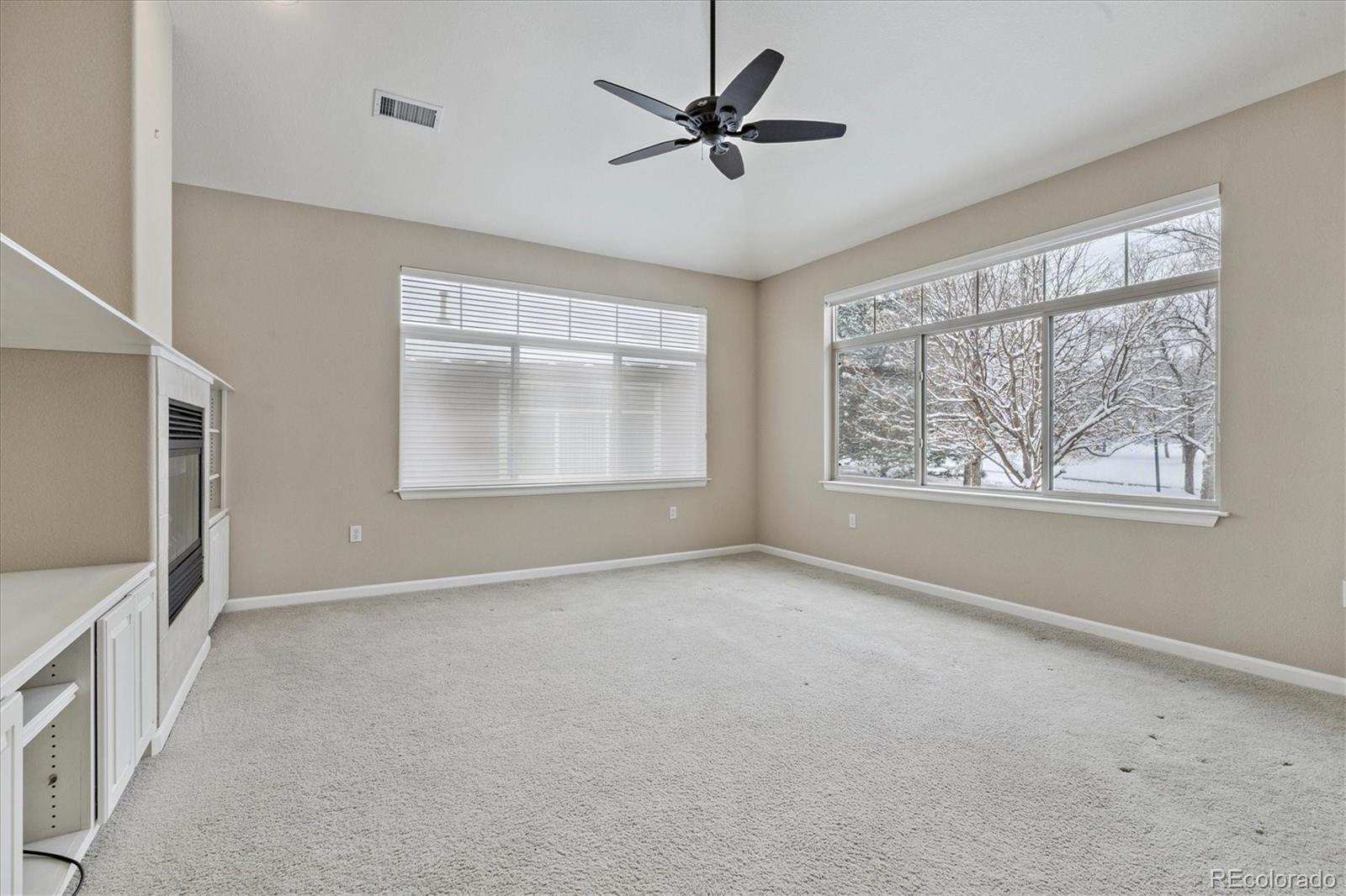 8650 Gold Peak Drive, Unit A Highlands Ranch, CO 80130 - Photo 25 of 47 a view of an empty room with a window