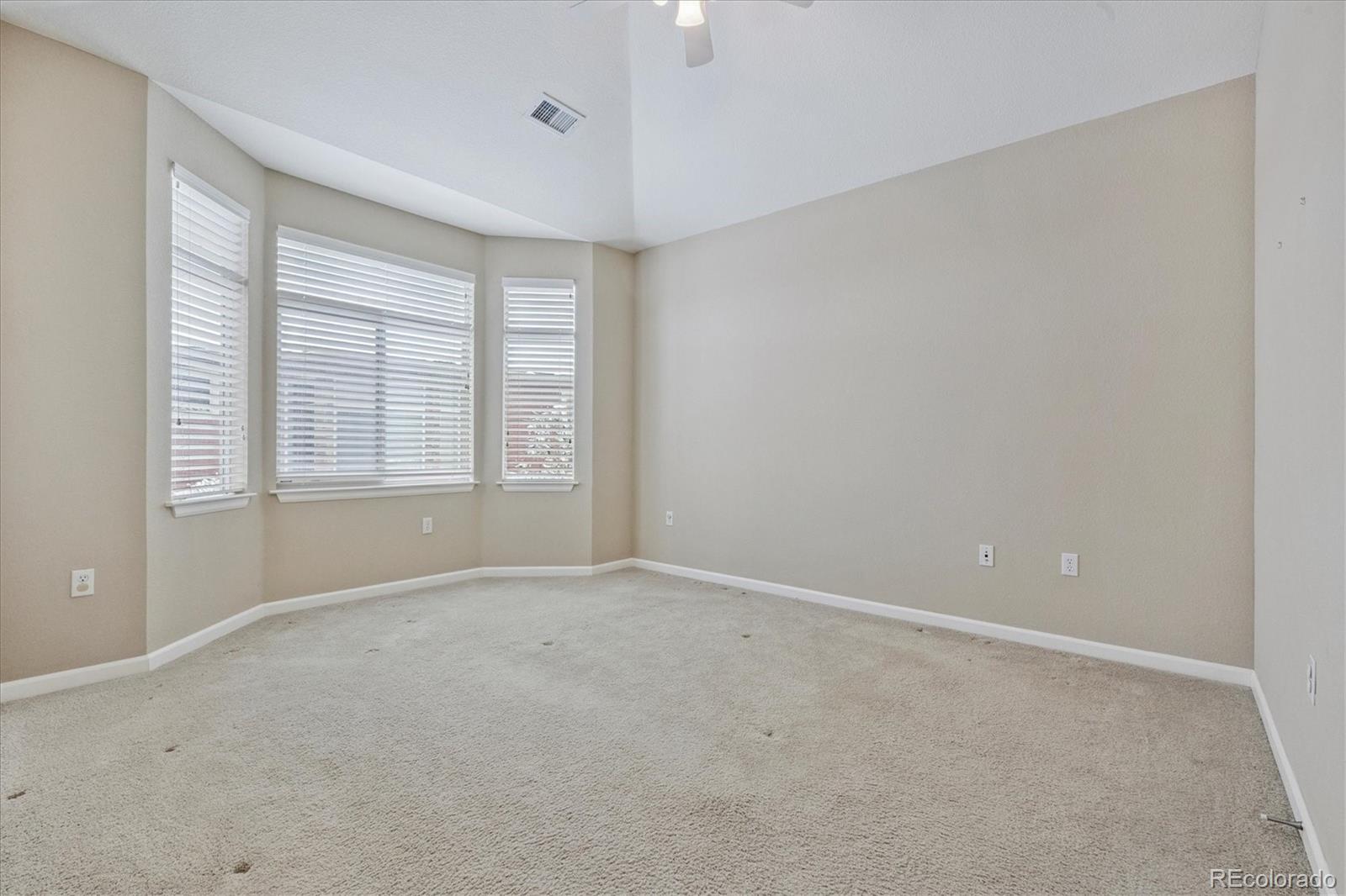 8650 Gold Peak Drive, Unit A Highlands Ranch, CO 80130 - Photo 29 of 47 a view of an empty room with a window