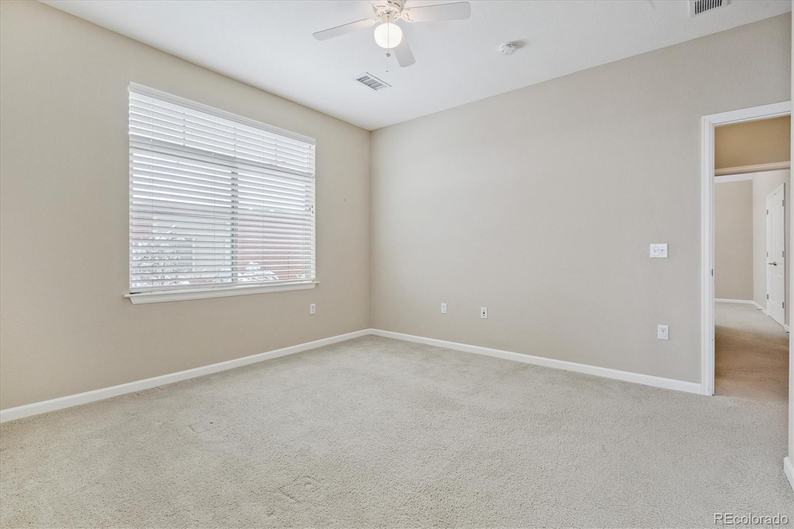 8650 Gold Peak Drive, Unit A Highlands Ranch, CO 80130 - Photo 36 of 47 a view of an empty room with a window