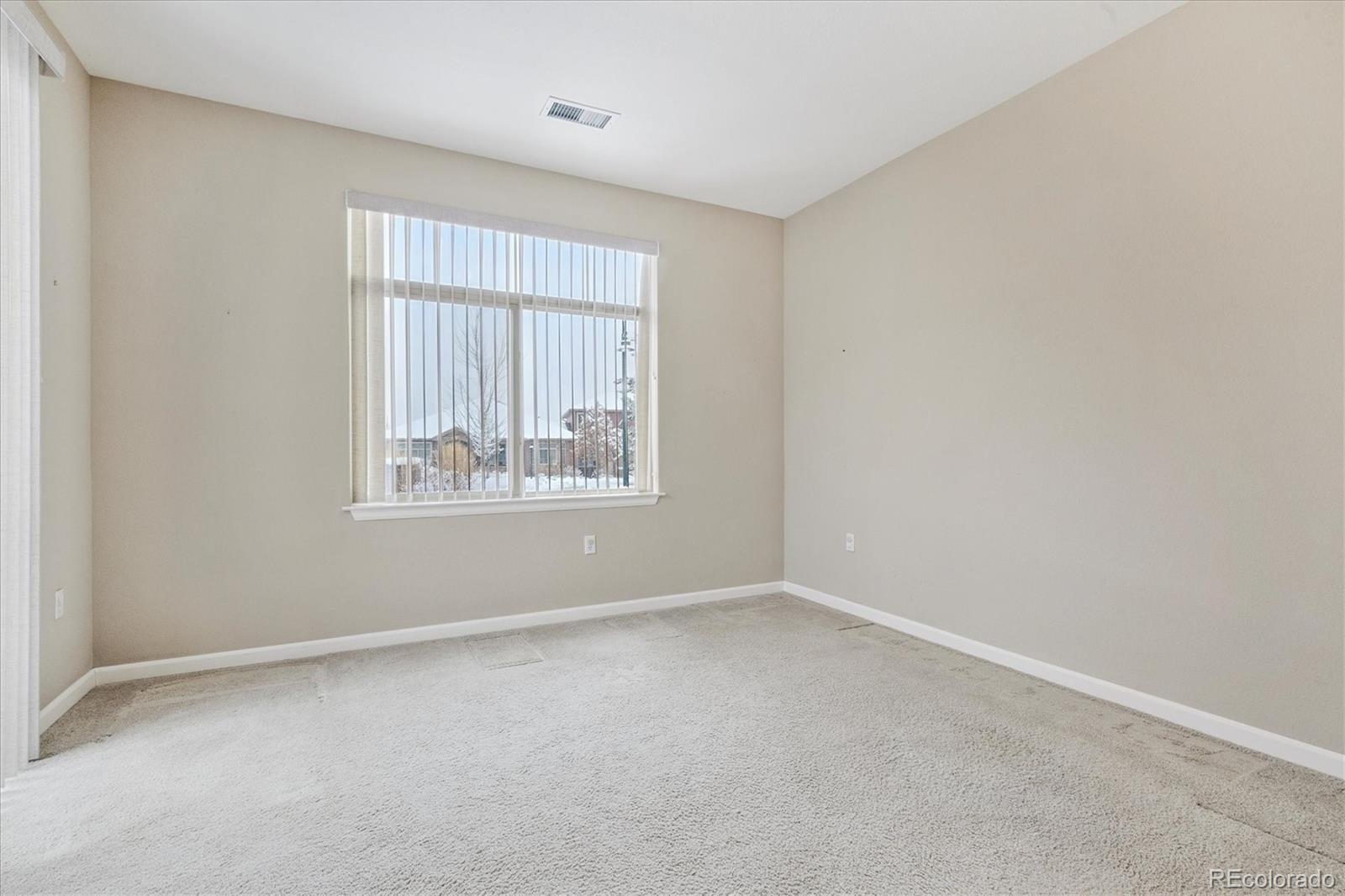 8650 Gold Peak Drive, Unit A Highlands Ranch, CO 80130 - Photo 40 of 47 an empty room with windows