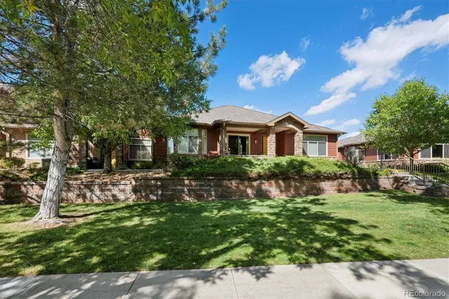 a front view of a house with a yard and porch
