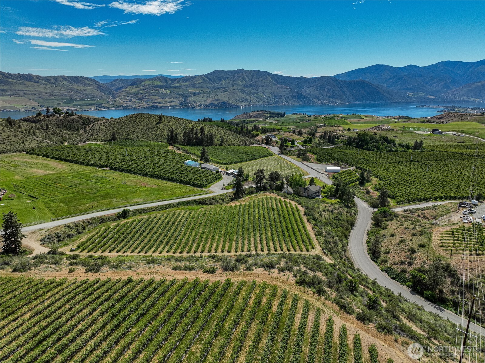 173 Chelan Ranch Road Chelan, WA 98816 - Photo 3 of 11 a view of a golf course with the ocean view
