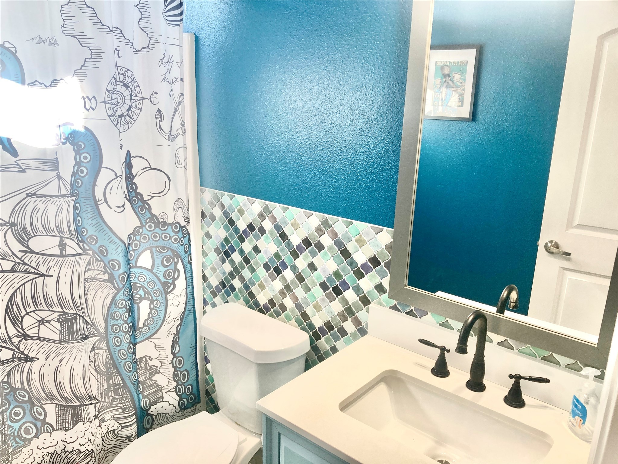 1830 Croaker Lane Crystal Beach, TX 77650 - Photo 11 of 21 a bathroom with a sink mirror vanity and toilet