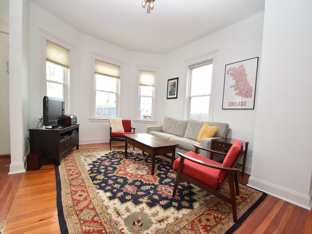 78 Montebello Road, Unit 3 Boston, MA 02130 - Photo 3 of 19 a living room with furniture and a rug