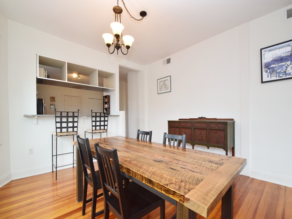 78 Montebello Road, Unit 3 Boston, MA 02130 - Photo 7 of 19 a dining room with a table chairs and wooden floor