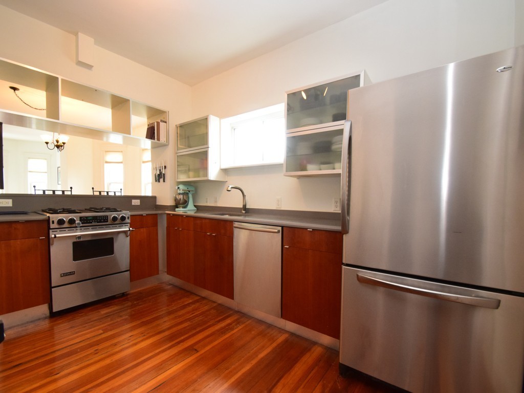 78 Montebello Road, Unit 3 Boston, MA 02130 - Photo 8 of 19 a kitchen with granite countertop a refrigerator stove and sink