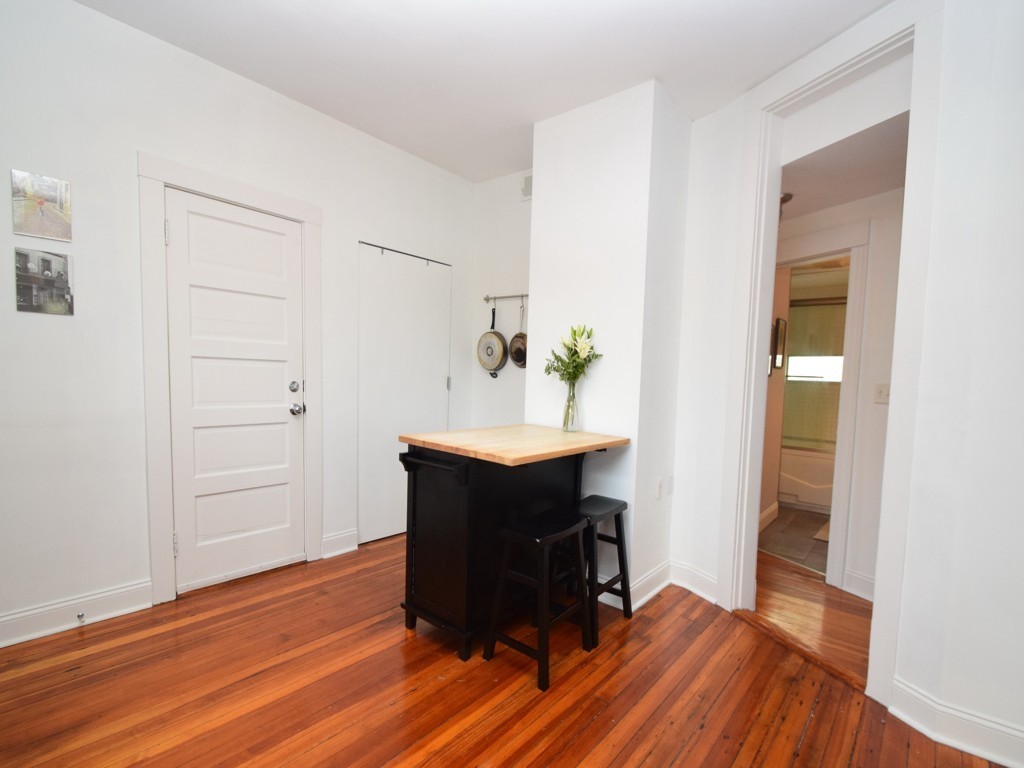 78 Montebello Road, Unit 3 Boston, MA 02130 - Photo 10 of 19 an empty room with wooden floor and cabinet