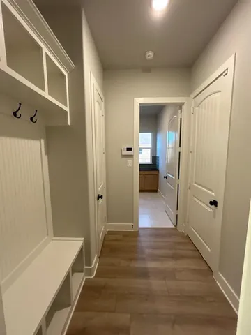 a kitchen with stainless steel appliances kitchen island granite countertop a stove a sink and a refrigerator