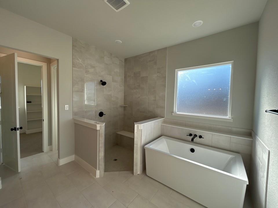 812 Vly Rdg Road Van Alstyne, TX 75495 - Photo 11 of 20 a bathroom with a tub and shower