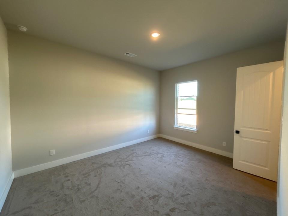 812 Vly Rdg Road Van Alstyne, TX 75495 - Photo 15 of 20 an empty room with a empty space and windows