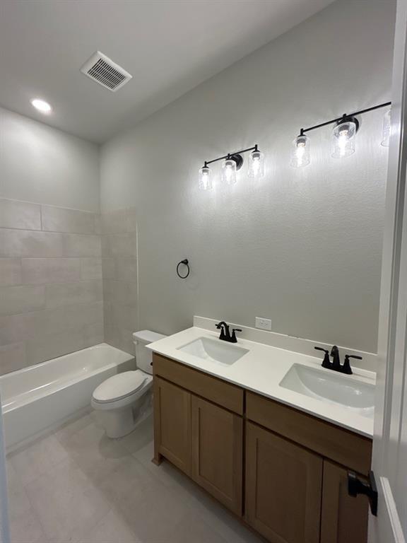812 Vly Rdg Road Van Alstyne, TX 75495 - Photo 17 of 20 a bathroom with a sink a toilet and shower