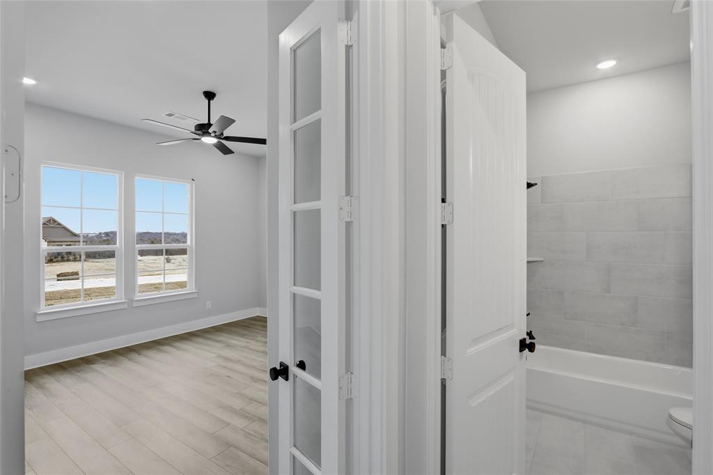 812 Vly Rdg Road Van Alstyne, TX 75495 - Photo 20 of 33 a view of a livingroom with a hardwood floor and a window