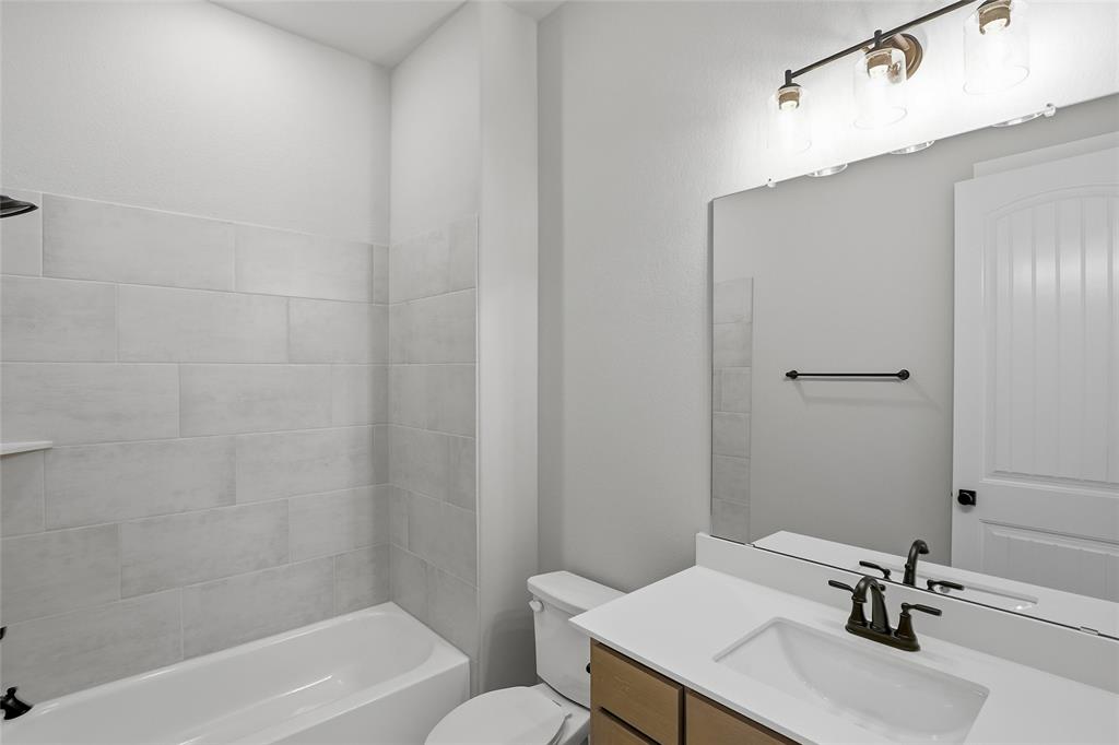 812 Vly Rdg Road Van Alstyne, TX 75495 - Photo 22 of 33 a bathroom with a sink toilet and shower