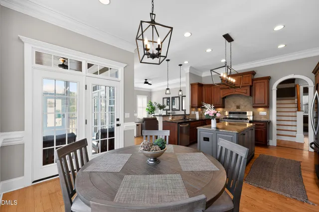 a bathroom with a double vanity sink mirror and toilet