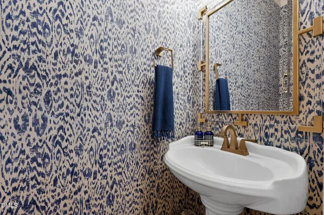 a view of a room that has a window and wooden floor