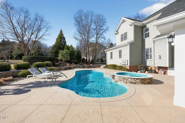 a view of a dining room with furniture wooden floor and chandelier