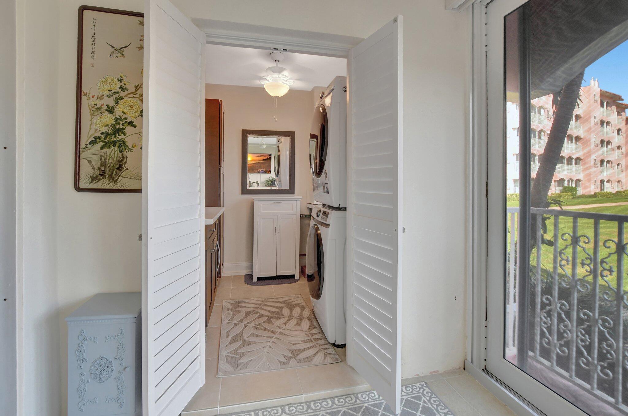 1099 South Ocean Boulevard, Unit 105 Boca Raton, FL 33432 - Photo 16 of 30 view of a hallway with wooden floor and a livingroom view