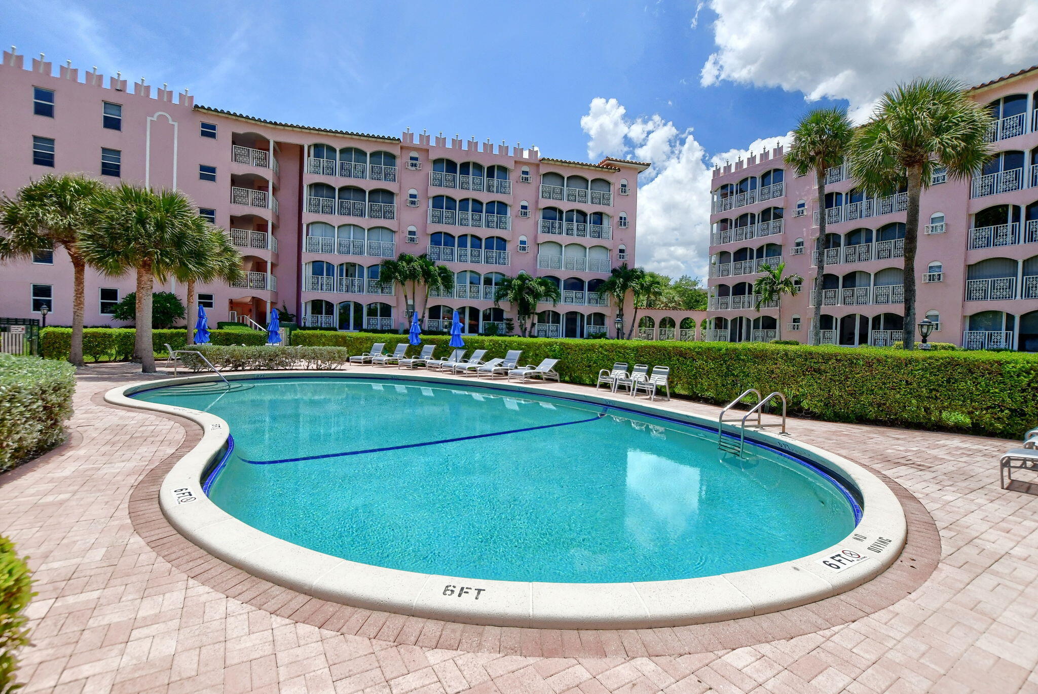 1099 South Ocean Boulevard, Unit 105 Boca Raton, FL 33432 - Photo 28 of 30 a view of a swimming pool and a buildings