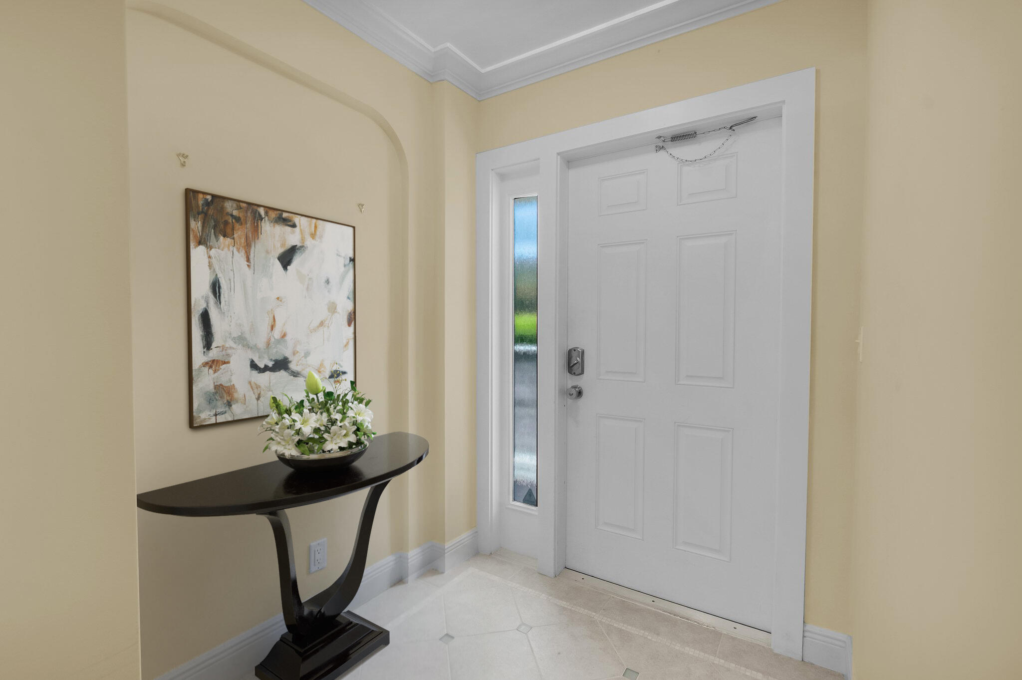 1099 South Ocean Boulevard, Unit 105 Boca Raton, FL 33432 - Photo 3 of 30 a view of a entryway with wooden floor