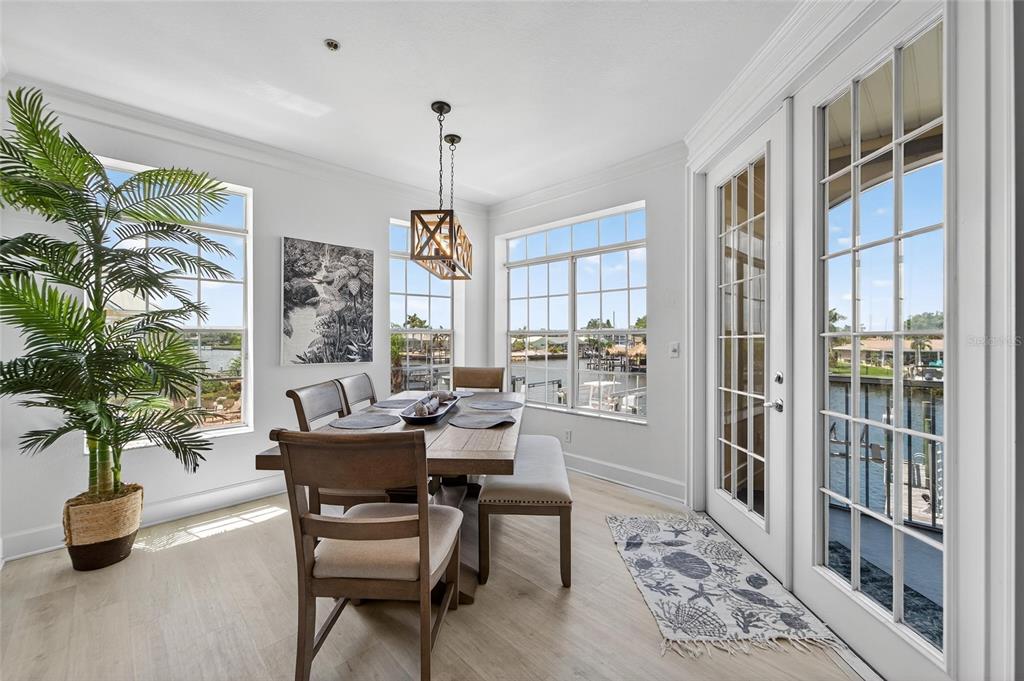 6428 Sunset Bay Circle Apollo Beach, FL 33572 - Photo 20 of 90 a dining room with furniture window and wooden floor